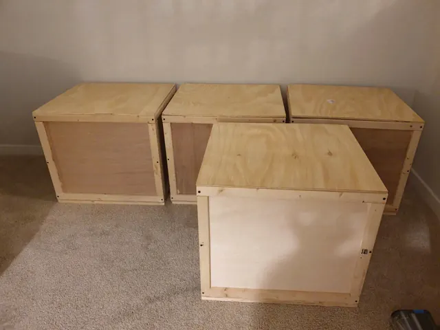 Four closed wooden packing crates